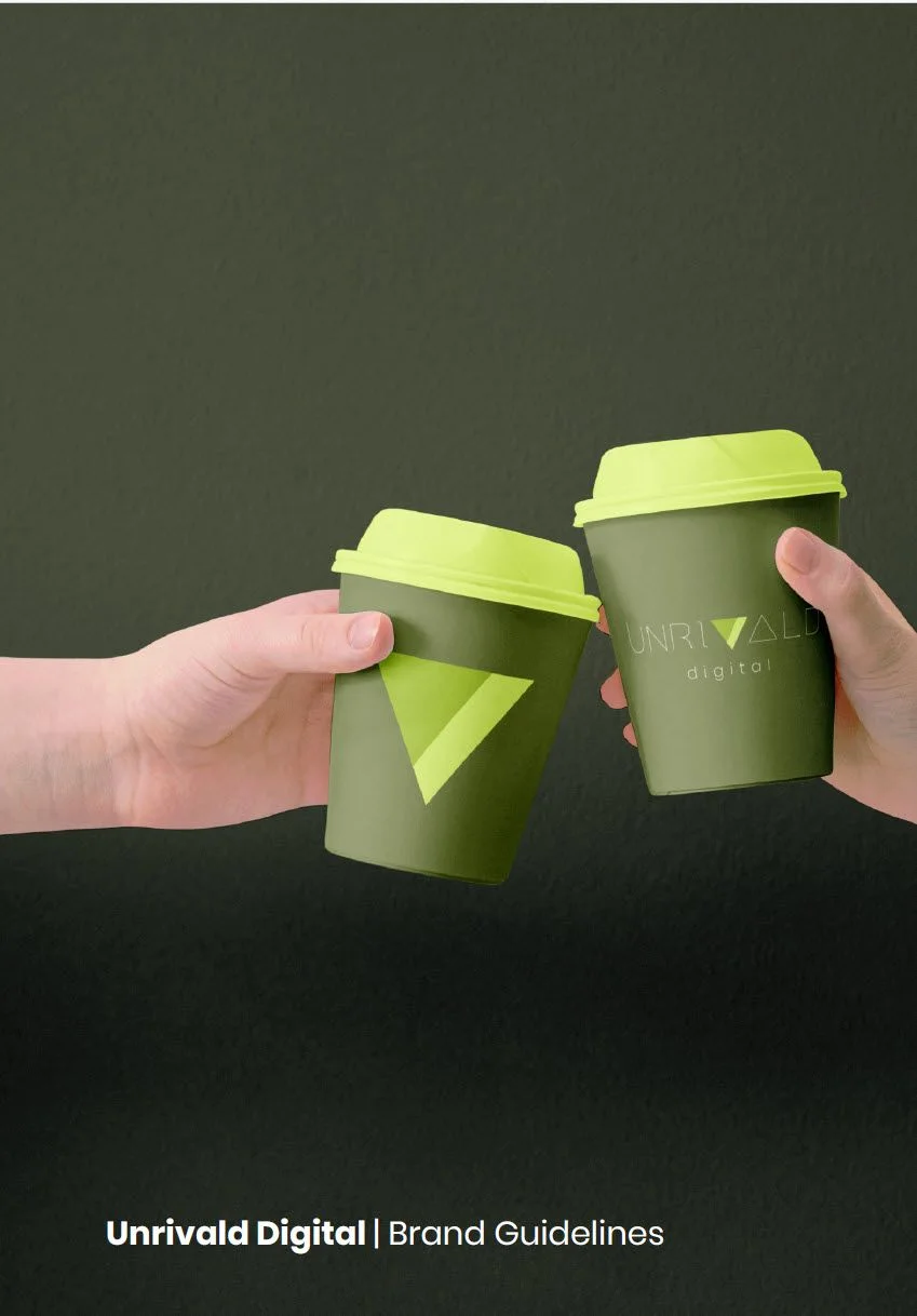 Two hands holding branded Unrivald Digital coffee cups